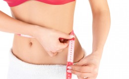 Healthcare and fitness – young fitness female keeping her diet.